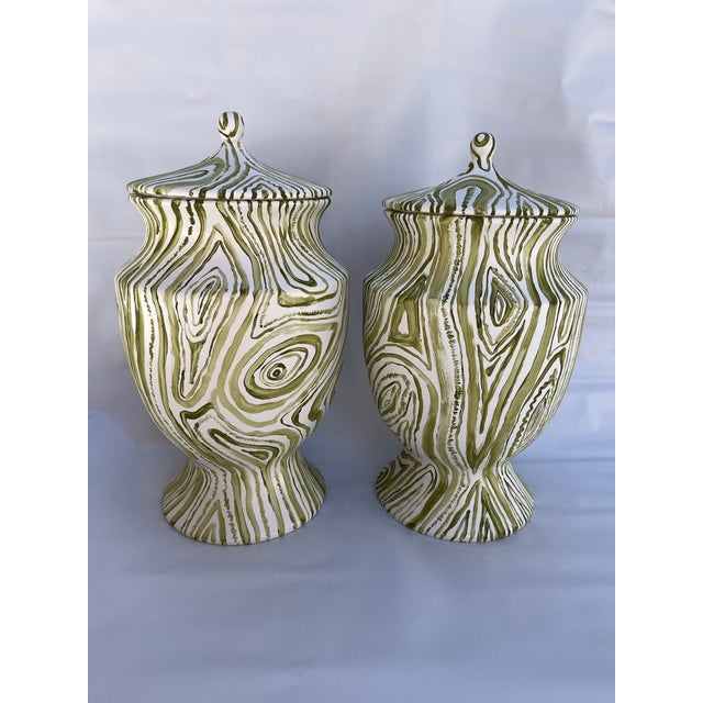 A matching pair of hand painted ceramic ginger jars with lids featuring a Four Seasons Antiques exclusive faux bois design...