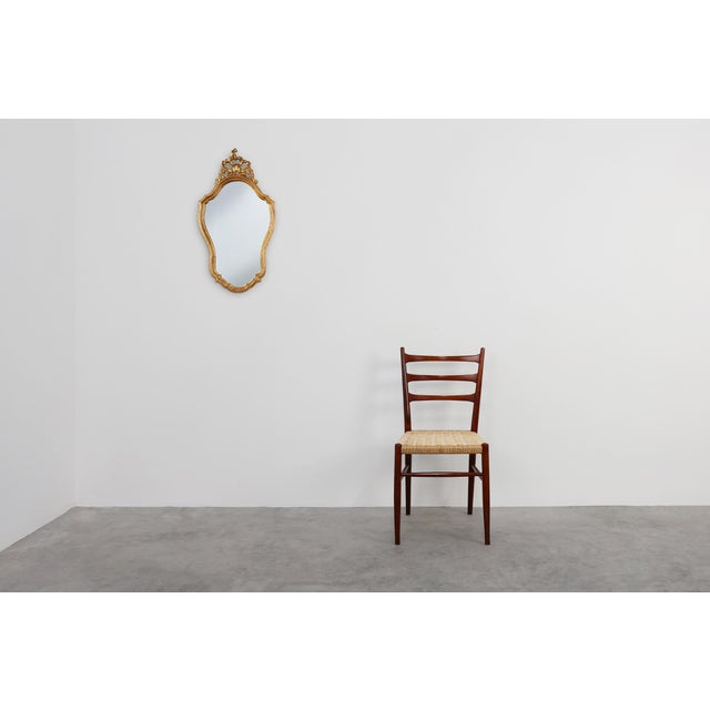 A richly ornamented creation by the renowned belgian maker deknudt, this 20th‑century mirror pays homage to the grandeur...
