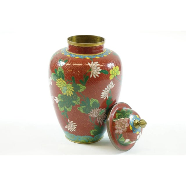 Early 20th Century Chinese Cloisonne Vase w/ top Red with white, blue and green flowers. Cloisonne is an ancient technique...
