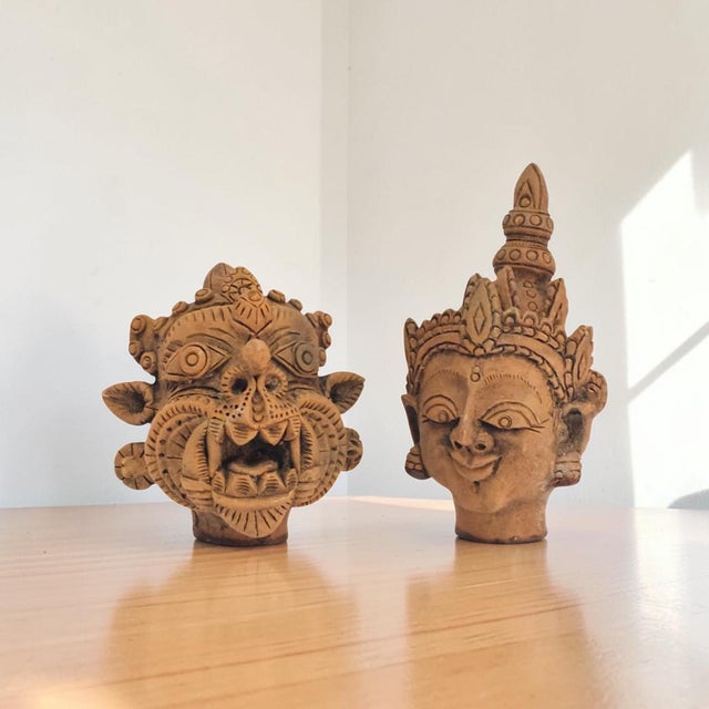 A matched pair of twentieth-century Southeast Asian terracotta character busts, best catalogued within the Thai Ramakien...