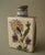 Early Qajar pottery tea flask with lid. Made of a composite clay with a grit paste, decorated with a sketchy floral design...