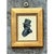 This vintage miniature portrait is a delicate profile silhouette of a gentleman, painted in deep slate-black tones on a...