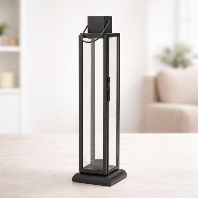 Elevate your décor with this Modern Iron and Glass Taper Candle Lantern. Designed with a sleek, elongated frame and clear...