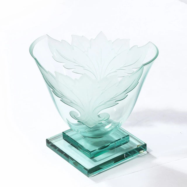 This stunning modernist vase was realized by the esteemed artisan Robert Guenter in the United States circa 1990. It...