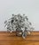 A finely crafted Curtis Jere-style tabletop sculpture depicting a windswept bonsai tree with individually hand-cut metal...