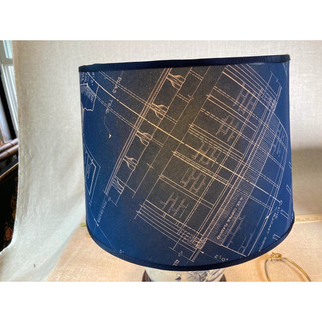 A lampshade that has been made from a vintage blueprint. Measurements: top11” side9” bottom13”