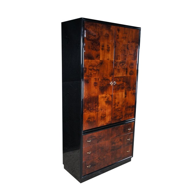 This imposing Henredon armoire showcases a striking Art Deco style, defined by its high-gloss, lacquered finish, bold...