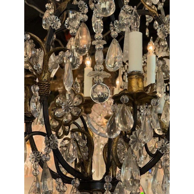This Vintage French Maison Bagues Bronze and Rock Crystal Chandelier exudes elegance and sophistication. The intricate...