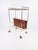 Mid-Century Modern Bar Cart/Newsstand (1960s/1970s, Germany, VOSS) This charming, mobile bar combines the elegance of Mid-...
