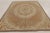 Handmade in wool, this 9x11 antique hooked rug dates to circa 1920-1930. The design features an elegant floral wreath...