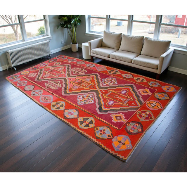 This monumental vintage flatweave, handwoven in 1984 in the Nakhcivan region of Eastern Anatolia, exemplifies the bold...