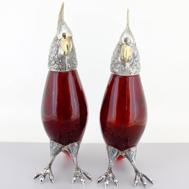 A fine pair of signed oil & vinegar cruet diminutive decanters or bottles. By Cartier. The bodies in ruby red cut glass...