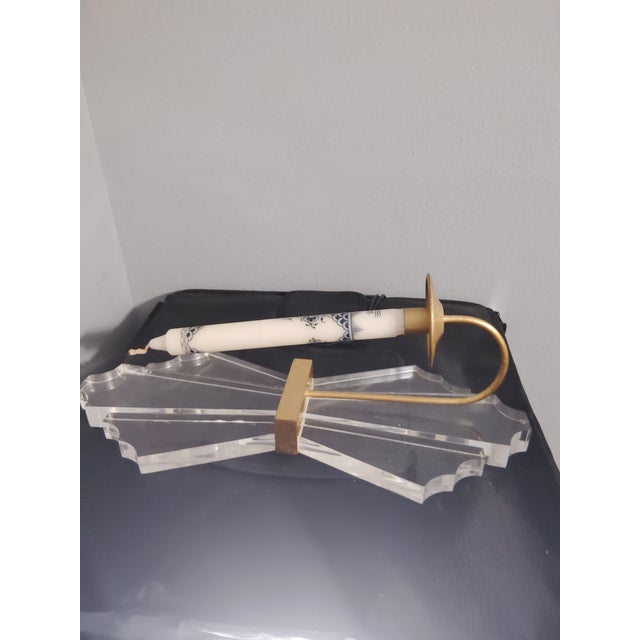 This is a vintage wall sconce, with gold tone trim. It has minimalist, elegant, modern look.