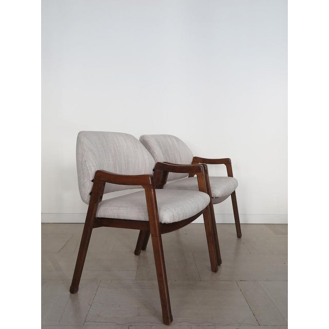 Pair of the model armchairs "814" designed by ICO Parisi for Cassina in 1961, Solid wood structure and new coating in...