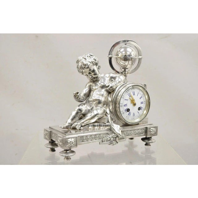 Antique French Louis XV Style Silver Plated Bronze Putto Mantel Clock by M Franjus Raison & Boyer. Item features signed...