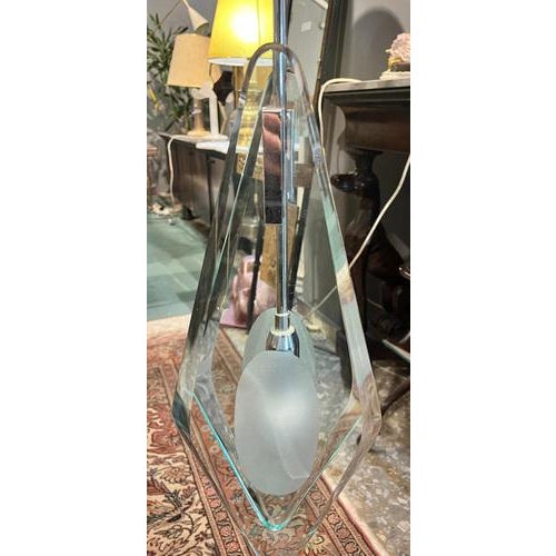 Suspension lamp attributed to Max Igrand of the 60s. The product was produced in good condition, but it has been damaged...