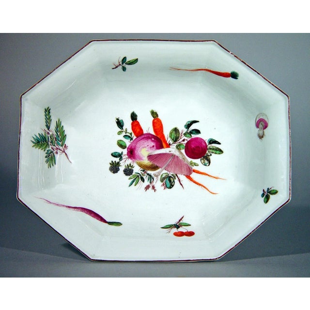 A wonderfully whimsical pair of Chelsea porcelain octagonal dishes, hand-painted around 1758-60 with tumbling arrangements...