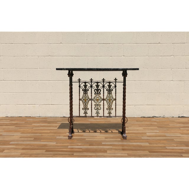 An exceptional Spanish Revival entry hall table, dating to circa 1910, beautifully handcrafted with a richly detailed...
