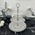 Elevate your next gathering with timeless, classic charm. This exquisite 3-tier clear glass serving stand features...