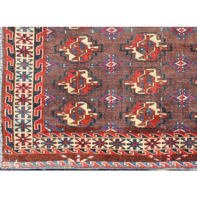19th Century Antique Tekke Rug With Brown Field and Tribal Motifs in Red For Sale - Image 4 of 6