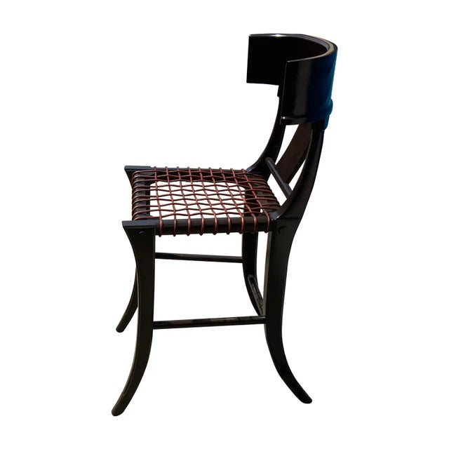 Mid century modern counter stools, set of 4. The Klismos style stool has a medium walnut finish. The stool is in excellent...