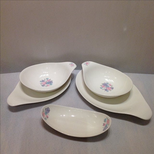 Offered is a set of scarce Hall China designed by Eva Zeisel circa 1950s featuring a blue, pink and purple floral pattern...