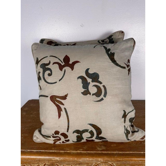 A sophisticated pair of decorative pillows crafted from authentic Nomi stenciled linen, showcasing a beautifully...