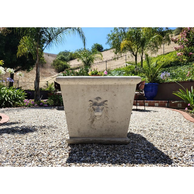 This beautiful large cast stone planter features majestic lion's head on all four sides of the planter. It is typical...