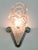 A pair of French Art Deco wall sconces by the French artist " Degue " in great condition. Shades are in clear frosted...