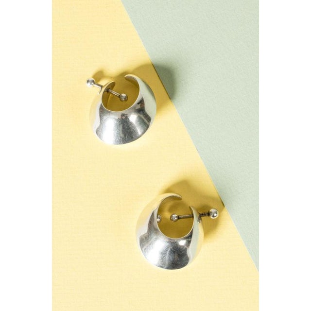 Cool silver earrings by Nanna Ditzel, model #126. Large, chunky design that is worn hanging inside the ear. No holes...