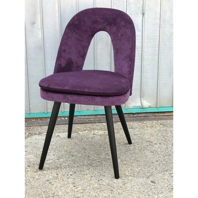 This set of two vintage dining chairs was designed by Czech designer Antonin Šuman in the 1960s. The chairs have been...