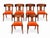 A striking set of six walnut Klismos dining chairs featuring beautifully figured wood grain, sweeping curved backrests,...