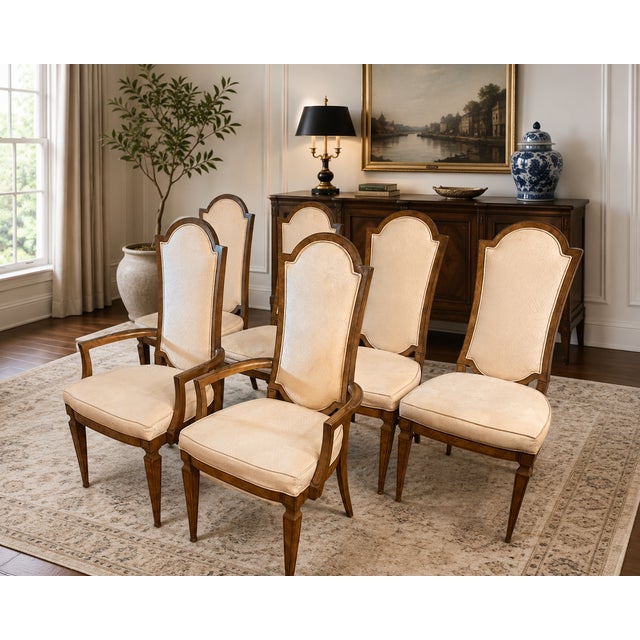 An elegant set of six vintage dining chairs attributed to Mastercraft, featuring the sophisticated combination of...
