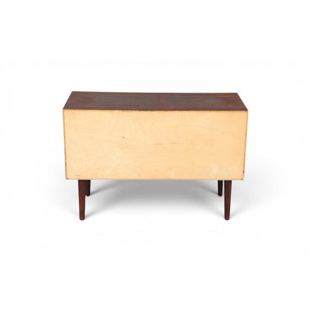 Designed by Johannes Sorth for Nexø, this compact rosewood chest of drawers proves that great Danish design doesn't need...
