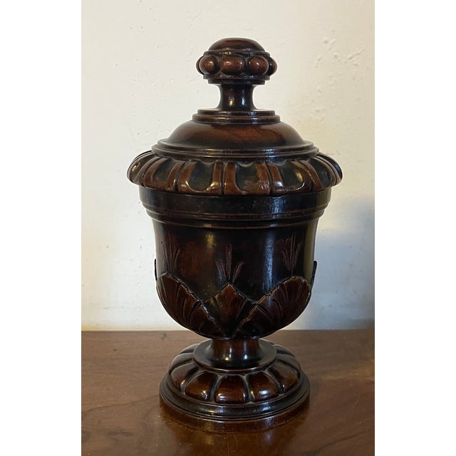 Antique 19th century English Regency carved treen mahogany urn. Measures 7 1/2" tall x 4 1/4" diameter. Good condition.