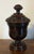 Antique 19th century English Regency carved treen mahogany urn. Measures 7 1/2" tall x 4 1/4" diameter. Good condition.