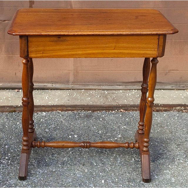 A 19th Century Victorian Mahogany Single Drawer work Table or Side Table Measures 26" in width, 16.5" in depth and 26.75"...