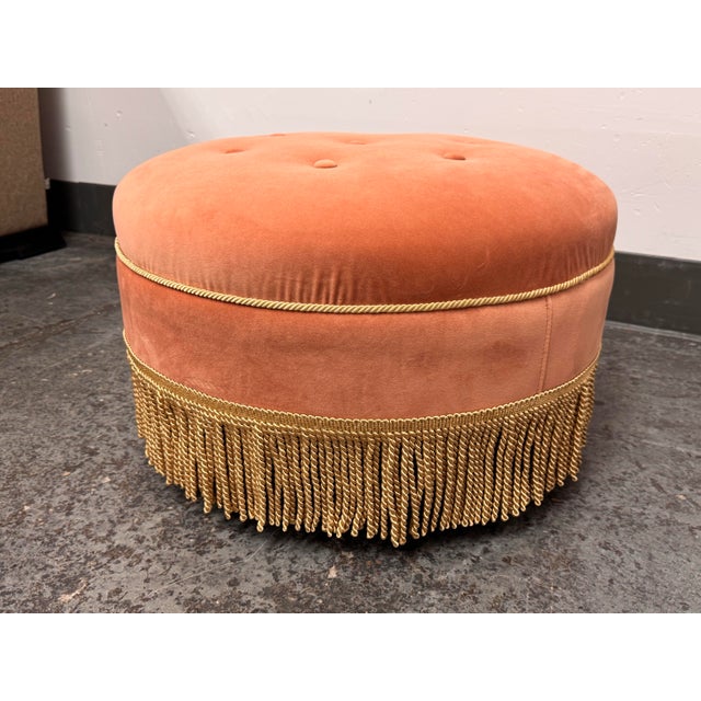 Design Plus Gallery presents the Yolanda Ottoman from Jennifer Taylor Home. Upholstered in peach-orange velvet, the...