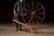 Large-scale wooden spinner's loom, commonly referred to as a walking wheel, used in hand-spinning wool and other fibers...