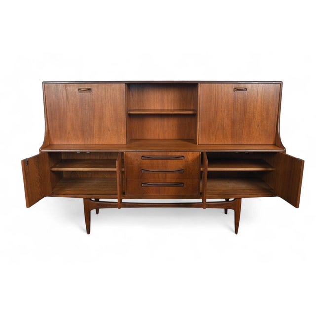 Origin: England Designer: Victor B. Wilkins Manufacturer: G Plan Era: 1966 Materials: Teak, Afromosia Measurements: 74″...