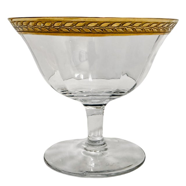 Beautiful gold encrusted low-stemmed coupe glasses made by Tiffin-Franciscan circa 1940and featuring 24K laurel gold bands...