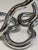 Chrome-finished Tangle sculpture designed by Richard X. Zawitz, one of the most recognizable explorations of interactive...