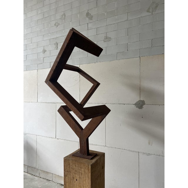 A striking example of 1970s geometric abstraction in steel. Created during the 1970s, Balance reflects the era’s...