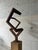 A striking example of 1970s geometric abstraction in steel. Created during the 1970s, Balance reflects the era’s...