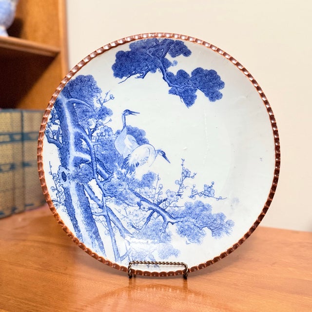A striking and cohesive pair of large Japanese blue and white porcelain chargers from the Meiji period (1868–1912), almost...