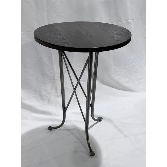 A distinctive Ethan Allen accent table from the Finland collection, blending rustic texture with industrial-inspired...