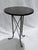 A distinctive Ethan Allen accent table from the Finland collection, blending rustic texture with industrial-inspired...