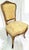 A French staple in any of the classes sitting rooms, this 1880-1890s French Louis XV style gilded parlor chair with rococo...