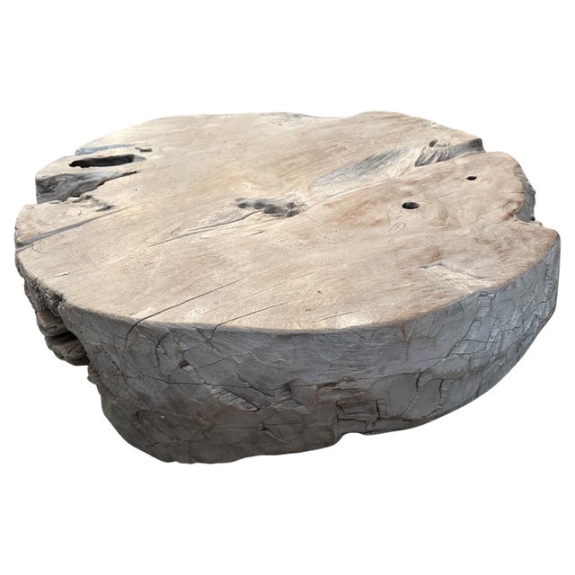 Beautiful patina on this aged teak wood round coffee table. Hand carved whilst respecting the natural organic wood. This...