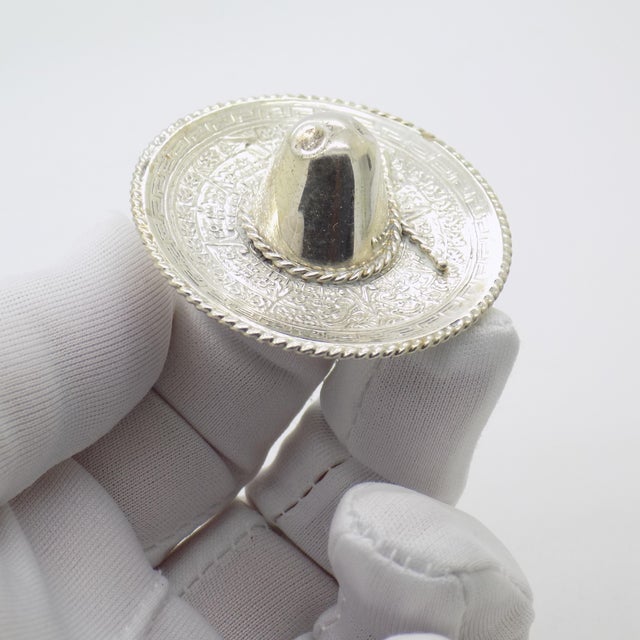 A charming vintage miniature depicting a Mexican sombrero, crafted between the 1970s and 1980s in genuine solid sterling...
